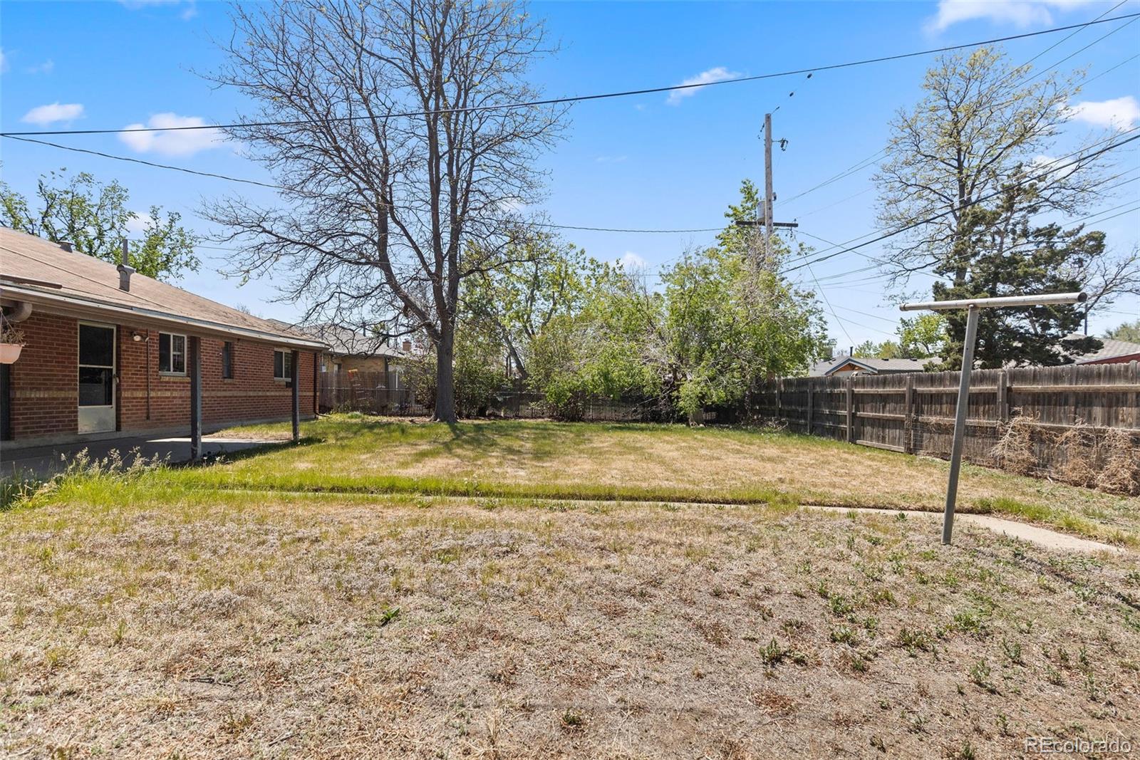 1283 Racine Street Aurora, CO 80011 - Photo 20 of 25 a view of a house with a yard