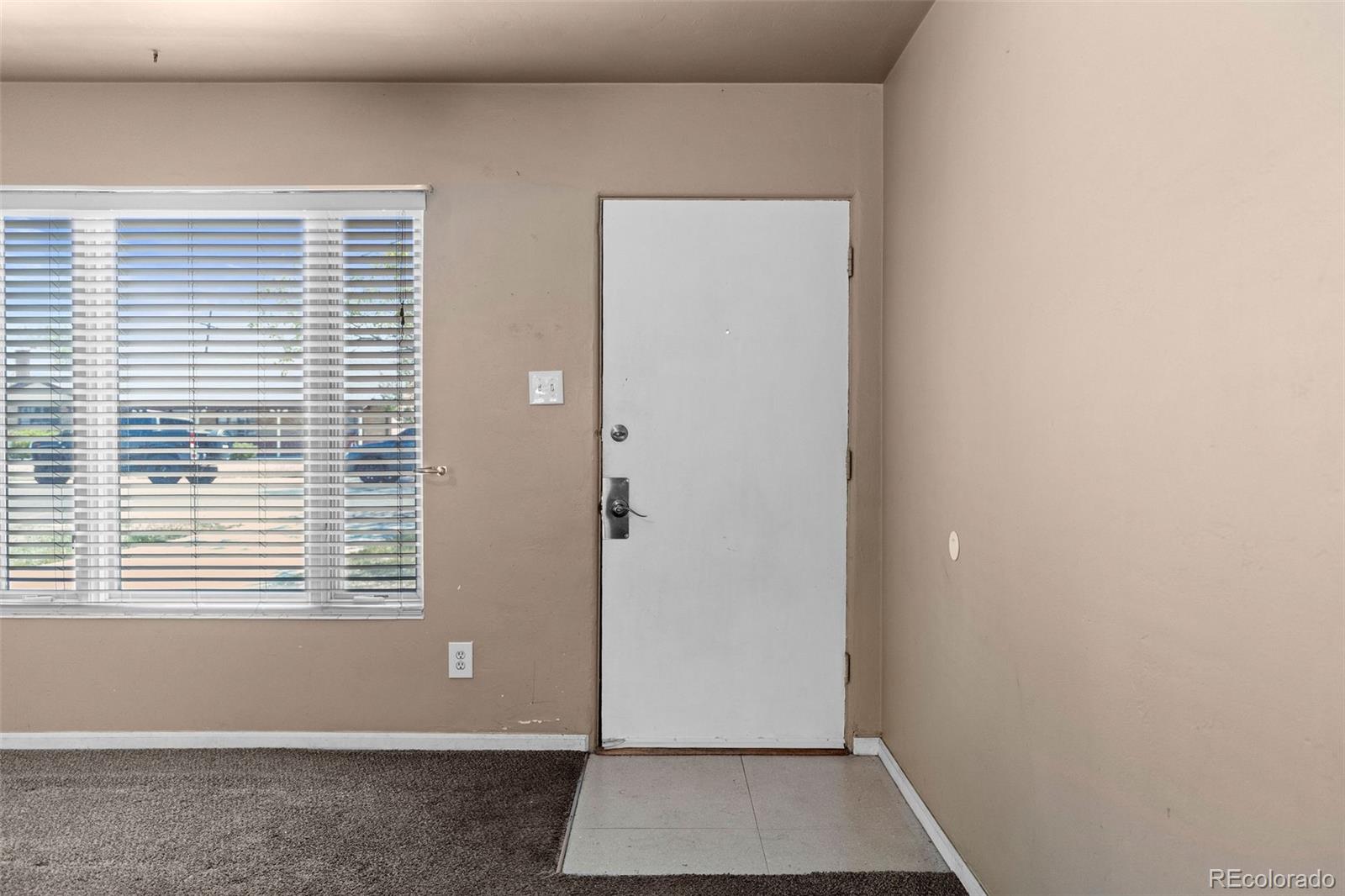 1283 Racine Street Aurora, CO 80011 - Photo 2 of 25 a view of room with window