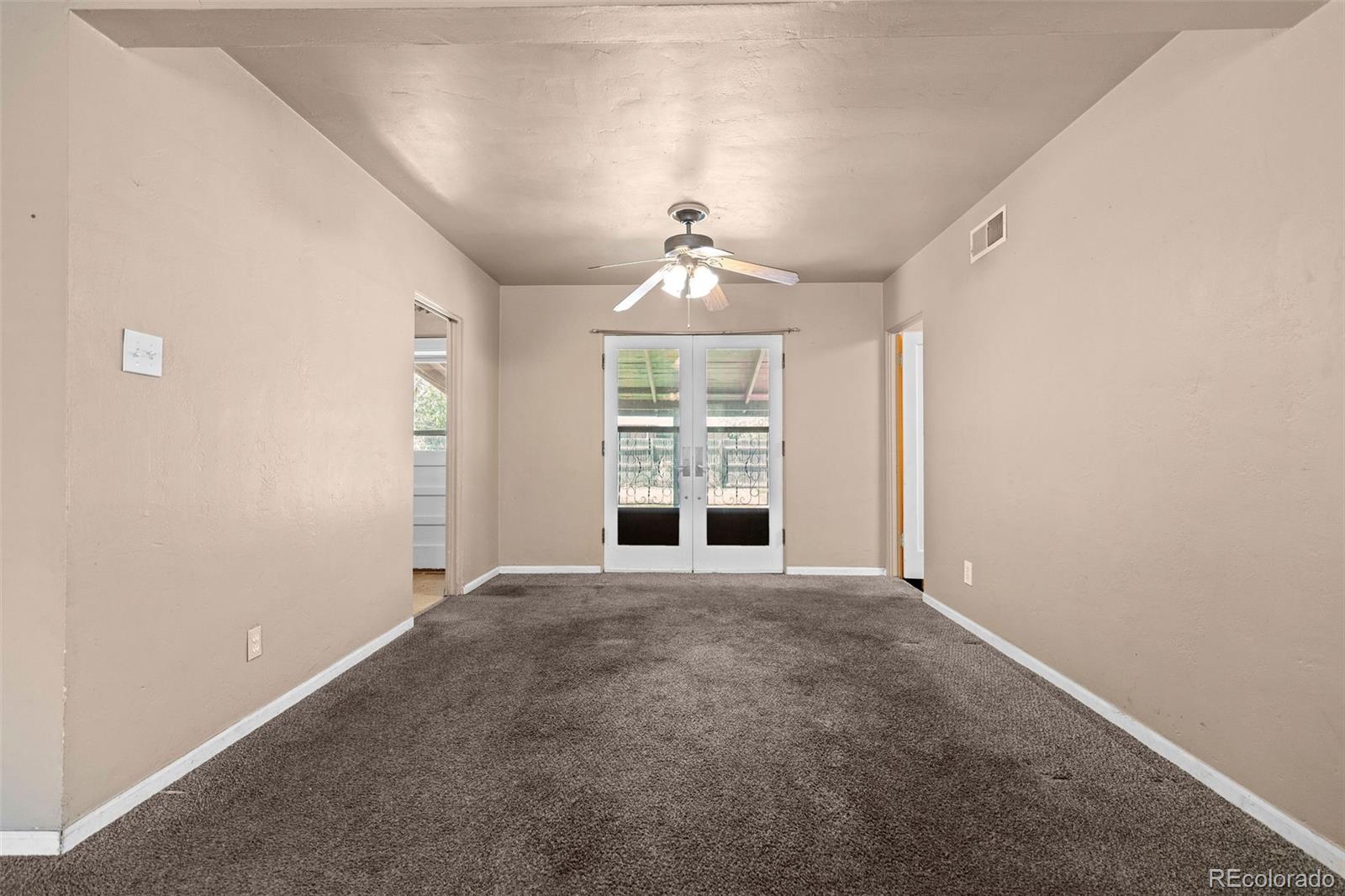 1283 Racine Street Aurora, CO 80011 - Photo 6 of 25 a view of an empty room with a window