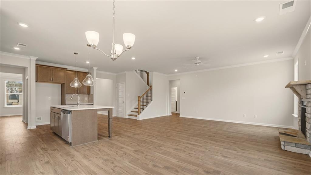 1908 Endress Circle Hampton, GA 30228 - Photo 11 of 35 a view of a big room with wooden floor and windows
