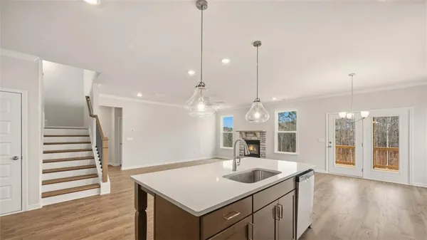 a view of a kitchen center island with wooden floor