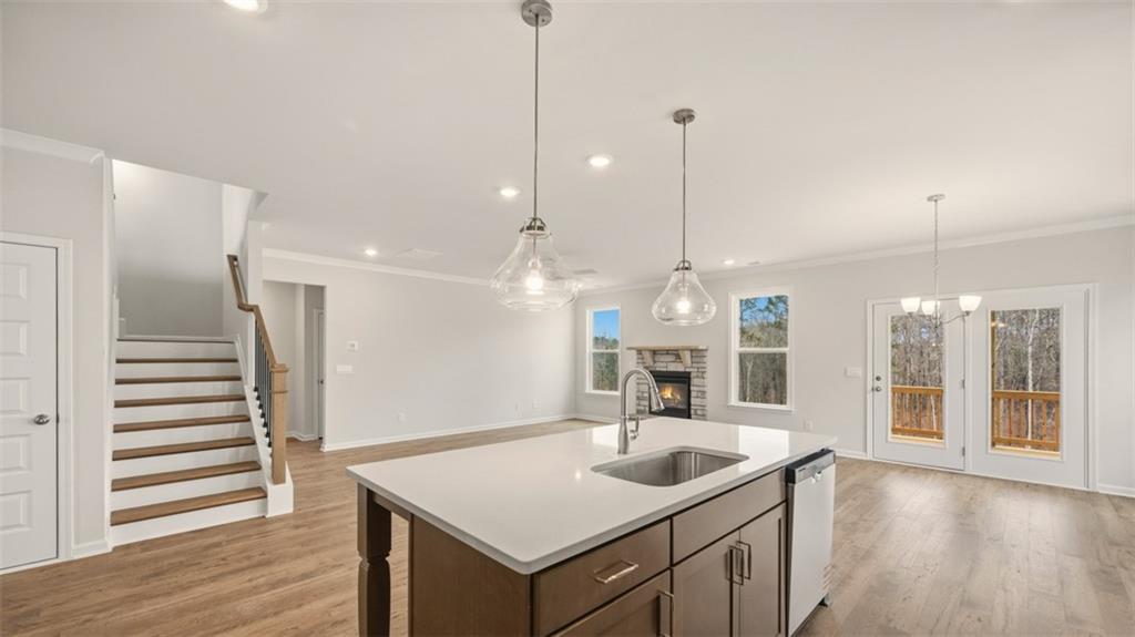 1908 Endress Circle Hampton, GA 30228 - Photo 13 of 35 a view of a kitchen center island with wooden floor
