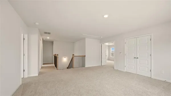 a view of an empty room with a fireplace