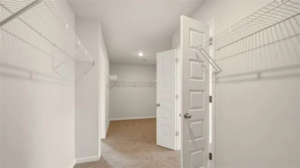 a bathroom with a shower and a glass door