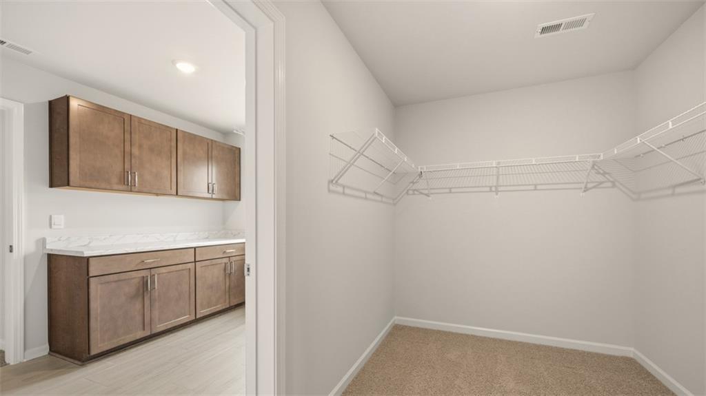 1908 Endress Circle Hampton, GA 30228 - Photo 29 of 35 a storage & utility room with cabinets