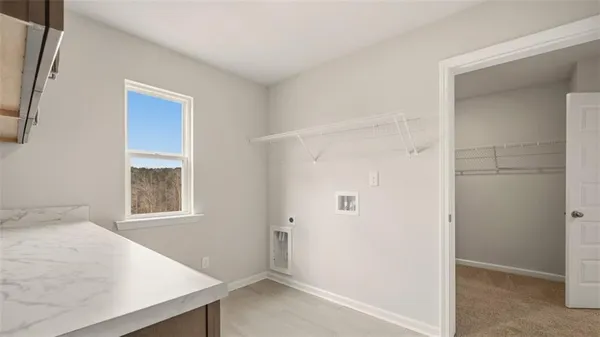 a view of a bedroom with wooden floor and hallway
