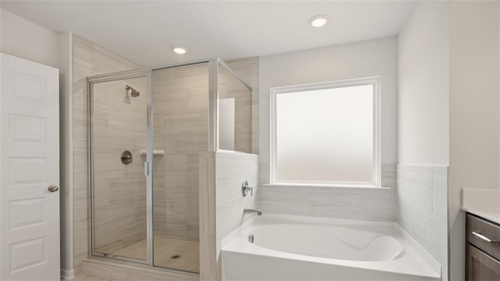 1908 Endress Circle Hampton, GA 30228 - Photo 35 of 35 a bathroom with a bathtub and a shower