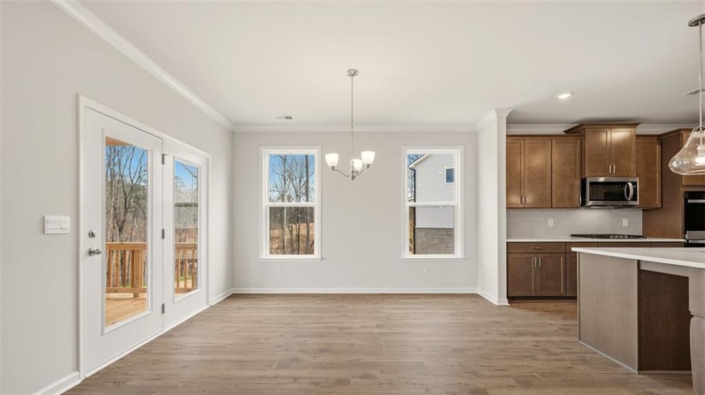 1908 Endress Circle Hampton, GA 30228 - Photo 9 of 35 a view of an empty room with kitchen and window