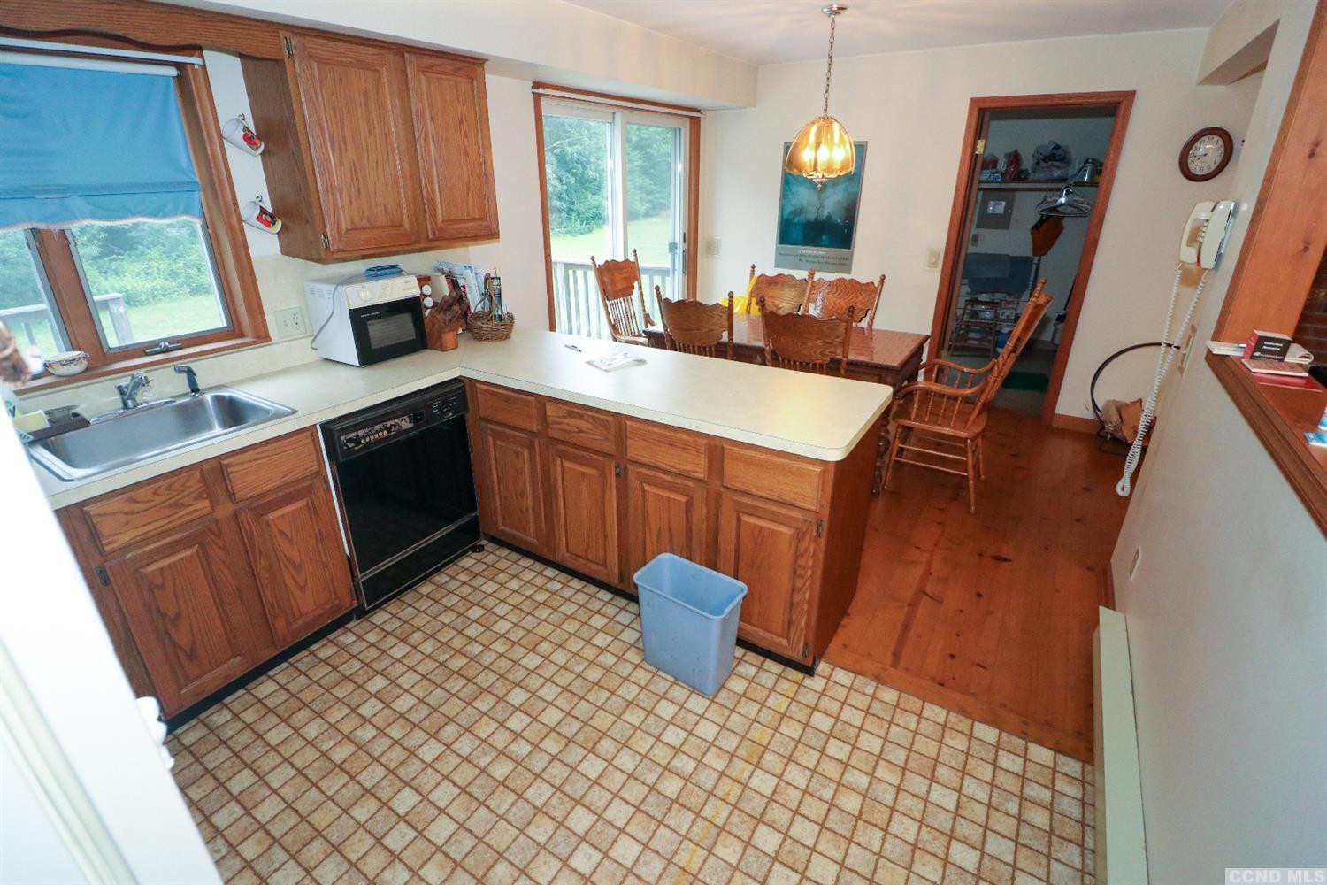 33 Viewmont Road Copake, NY 12516 - Photo 14 of 26 a kitchen with a sink stove and cabinets