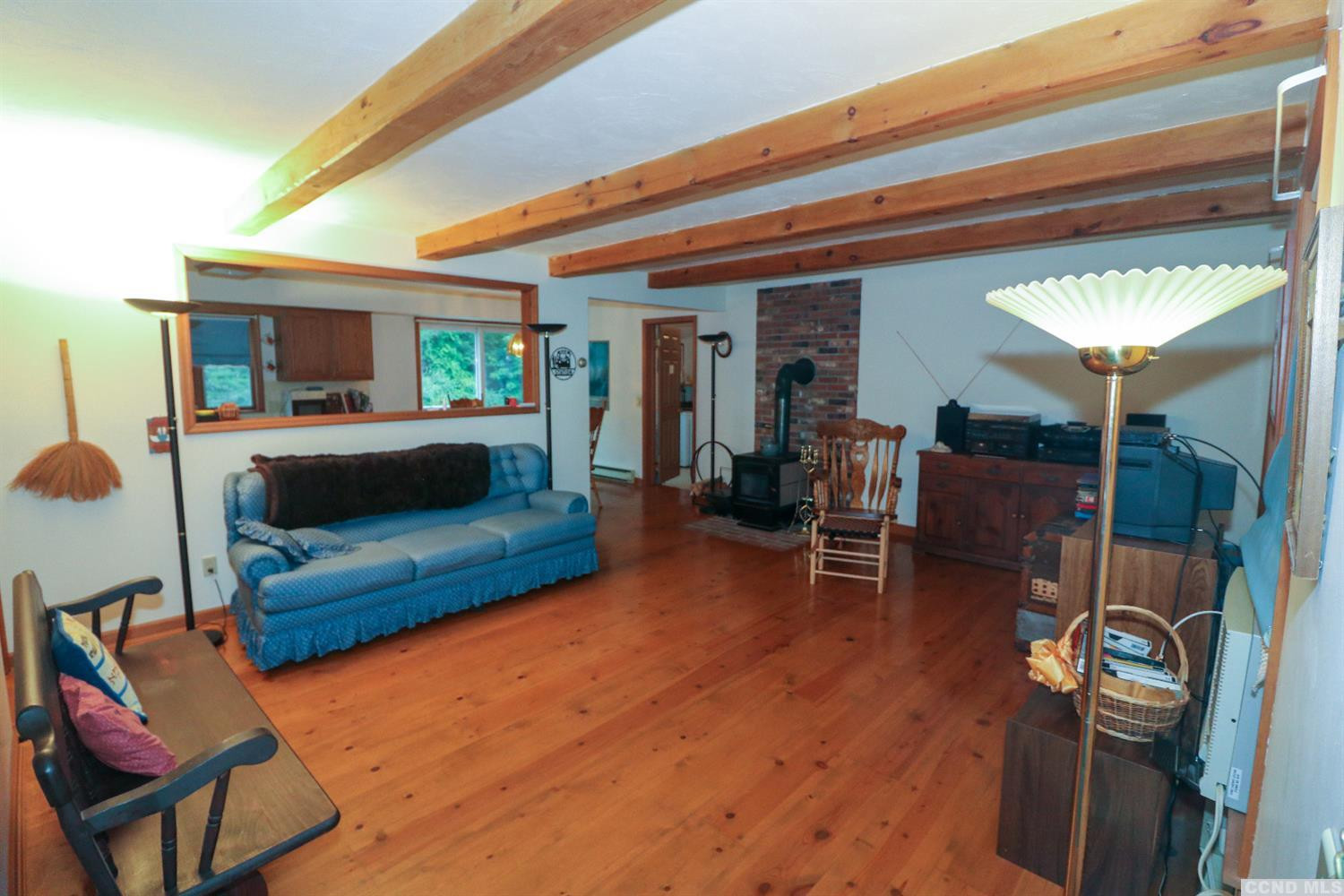 33 Viewmont Road Copake, NY 12516 - Photo 5 of 26 a living room with furniture and a wooden floor