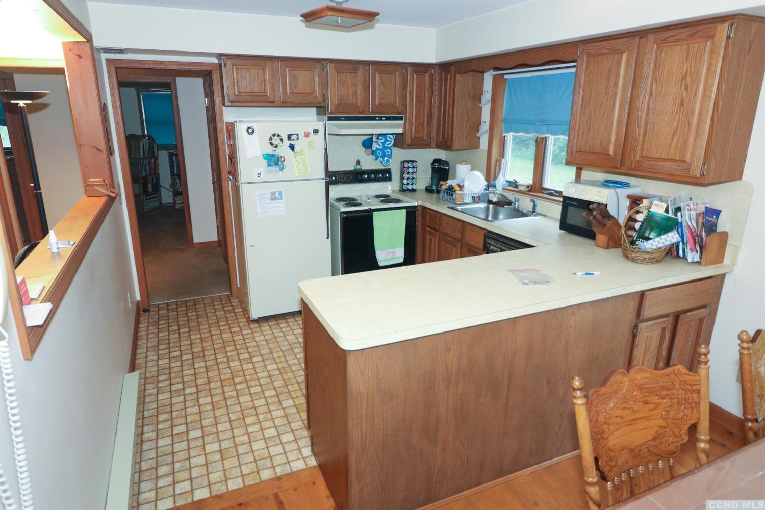 33 Viewmont Road Copake, NY 12516 - Photo 9 of 26 a kitchen with stainless steel appliances a refrigerator a sink a stove a microwave and cabinets