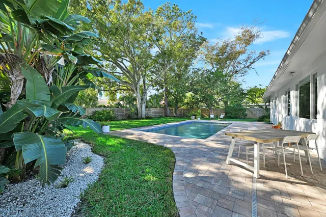 a view of a swimming pool with a patio