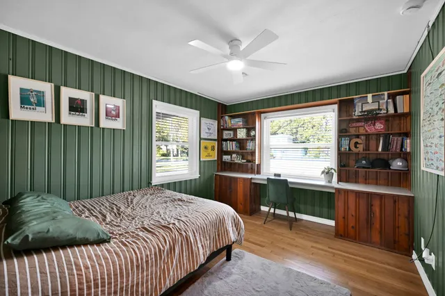 a bedroom with a large bed and a window