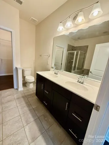 a bath tub sitting next to a white sink