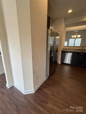 a view of a hallway view with wooden floor and staircase
