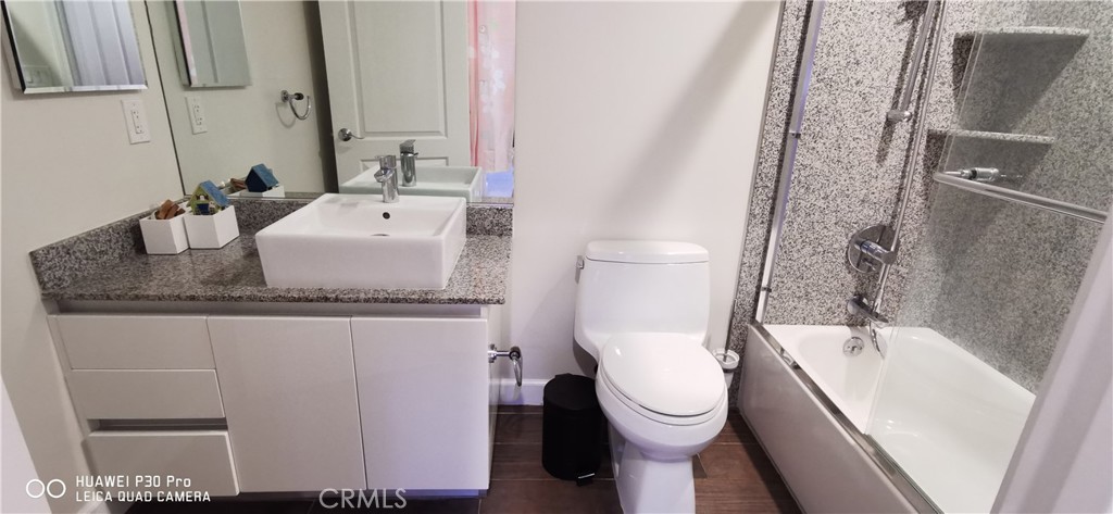 28 North 3rd Street, Unit B208 Alhambra, CA 91801 - Photo 16 of 27 a bathroom with a granite countertop sink toilet and shower