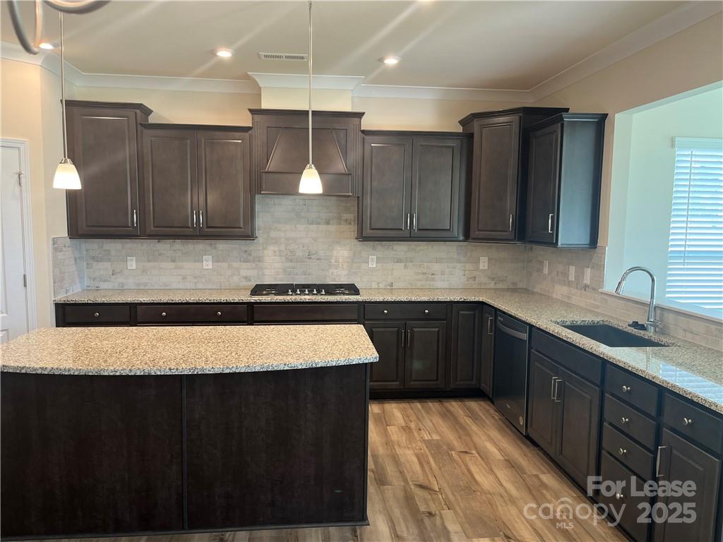 11506 Oakhampton Way Matthews, NC 28105 - Photo 11 of 27 a kitchen with a sink and cabinets