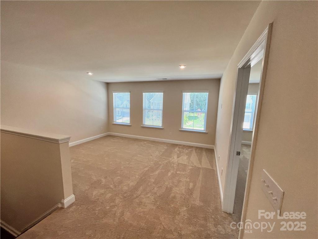 11506 Oakhampton Way Matthews, NC 28105 - Photo 17 of 27 a view of an empty room with a window