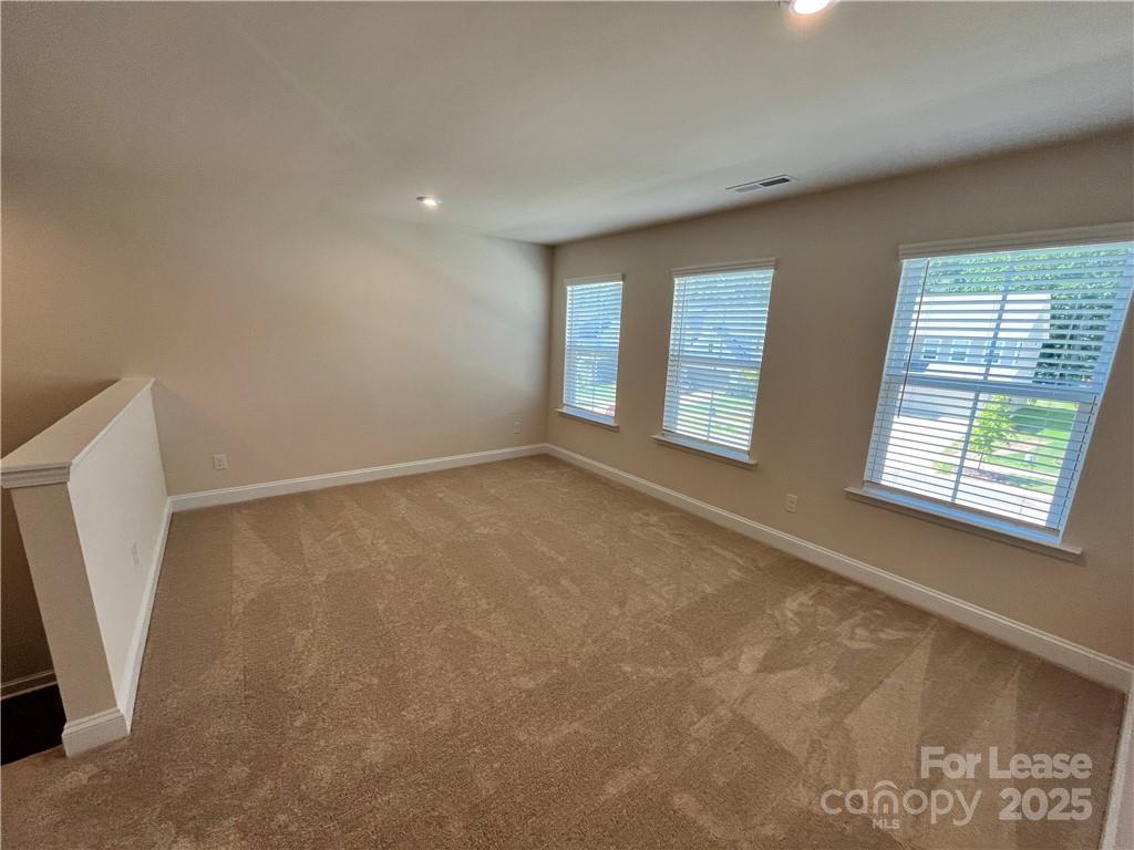 11506 Oakhampton Way Matthews, NC 28105 - Photo 18 of 27 a view of an empty room with a window