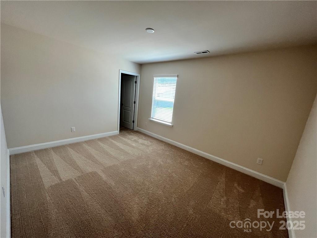 11506 Oakhampton Way Matthews, NC 28105 - Photo 20 of 27 a view of an empty room and window