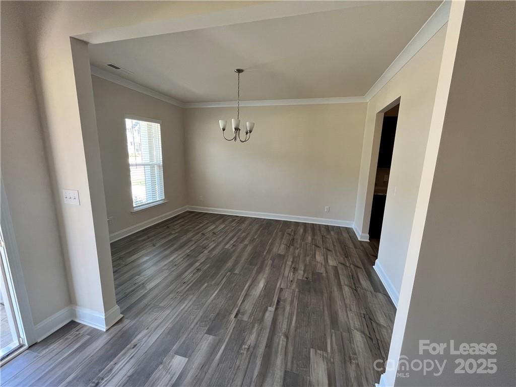 11506 Oakhampton Way Matthews, NC 28105 - Photo 4 of 27 wooden floor in an empty room with a window