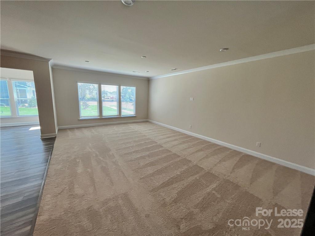 11506 Oakhampton Way Matthews, NC 28105 - Photo 8 of 27 wooden floor in an empty room with a window