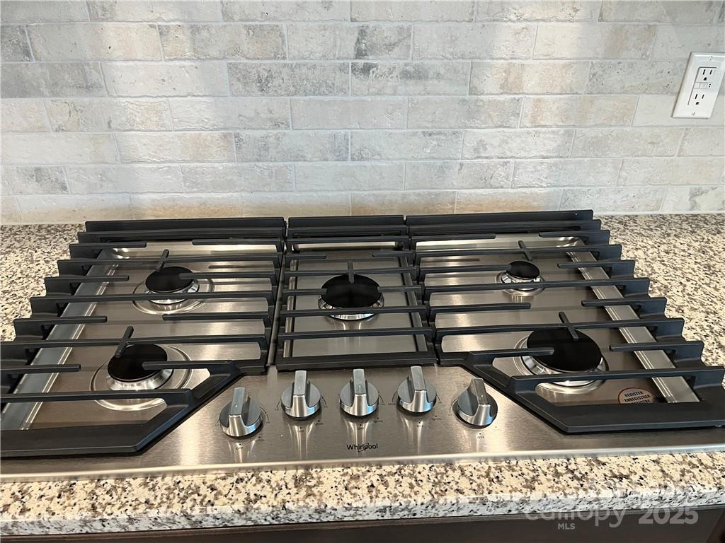 11506 Oakhampton Way Matthews, NC 28105 - Photo 10 of 27 a close view of stove and has a wooden floor