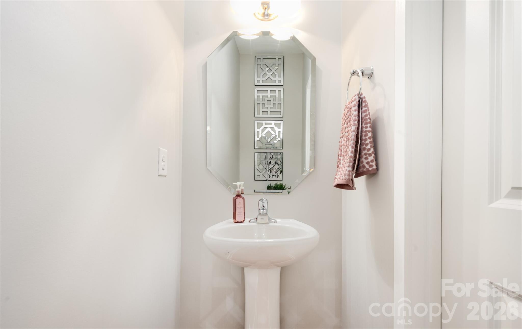 4822 Tradd Circle Monroe, NC 28110 - Photo 12 of 21 a bathroom with a sink and a mirror
