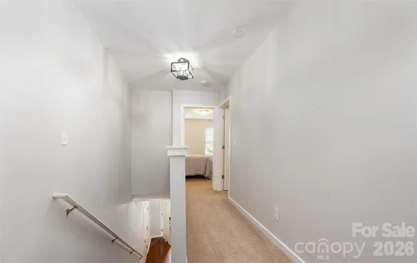 a view of a hallway with an empty room