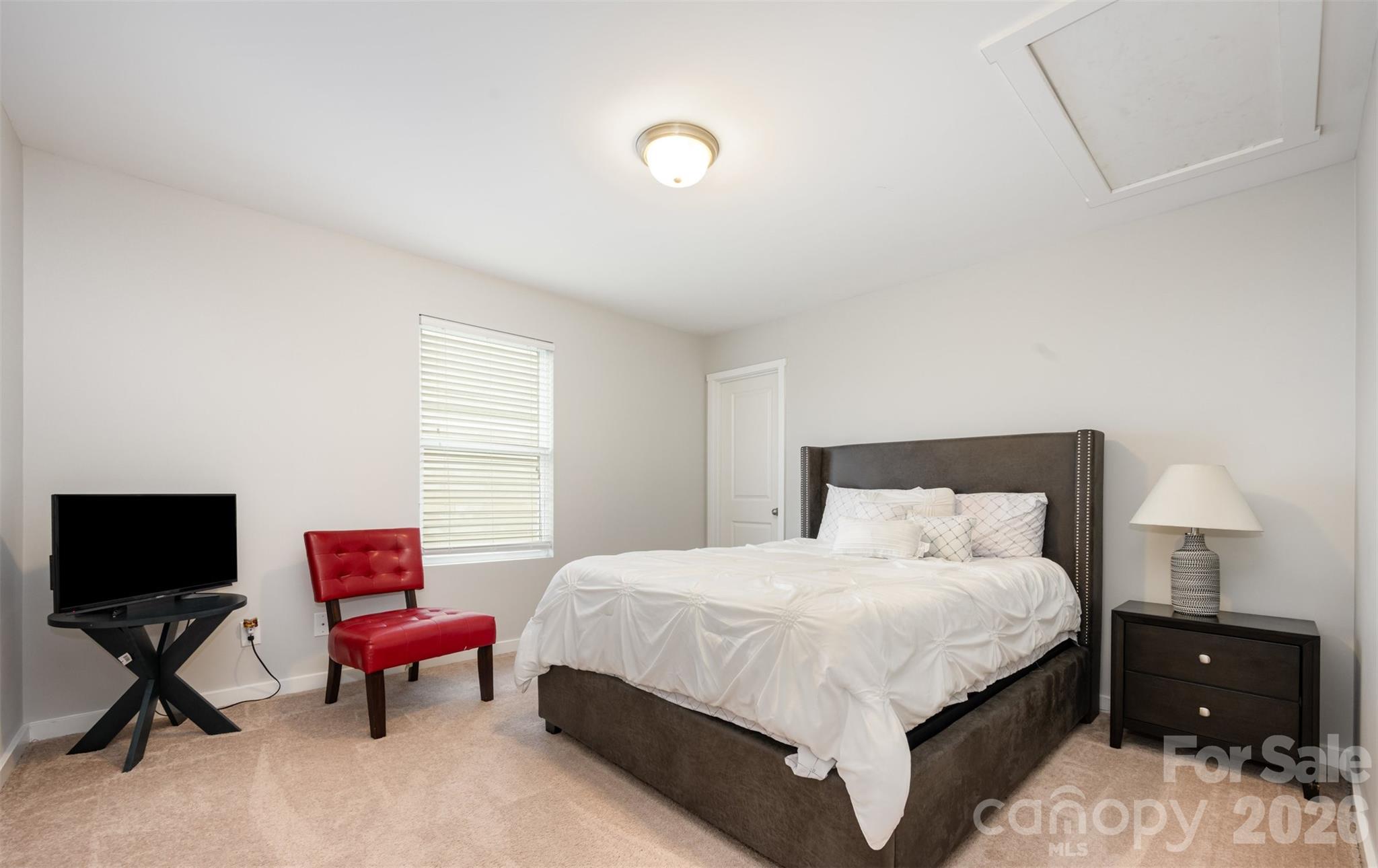 4822 Tradd Circle Monroe, NC 28110 - Photo 18 of 21 a bedroom with a bed and a chair