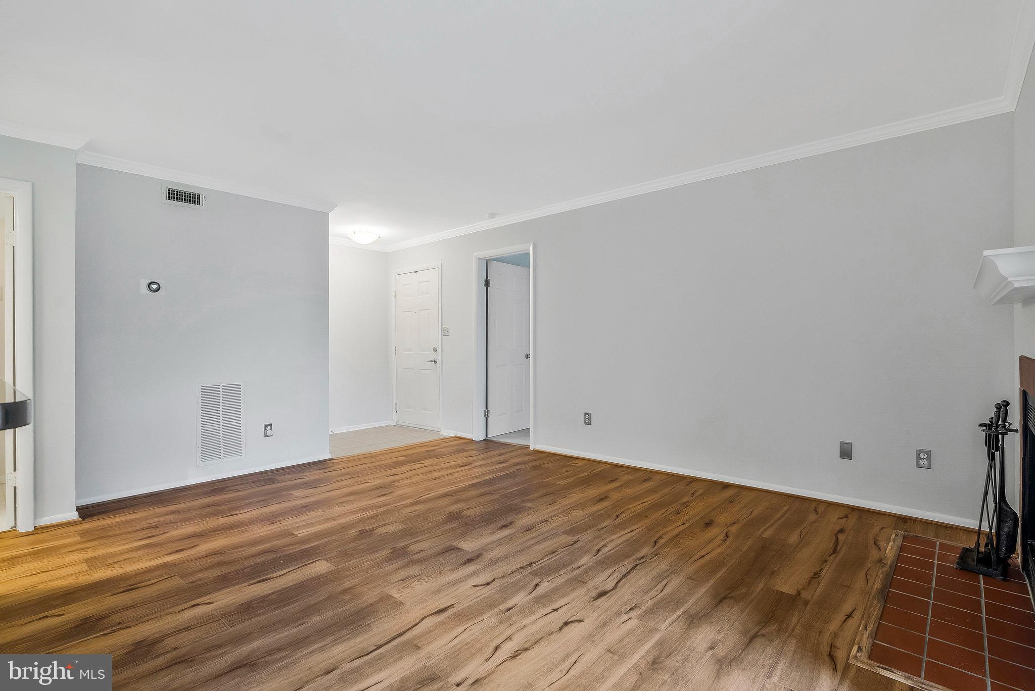 1701 Ascot Way, Unit 1701A Reston, VA 20190 - Photo 12 of 32 a view of empty room with wooden floor
