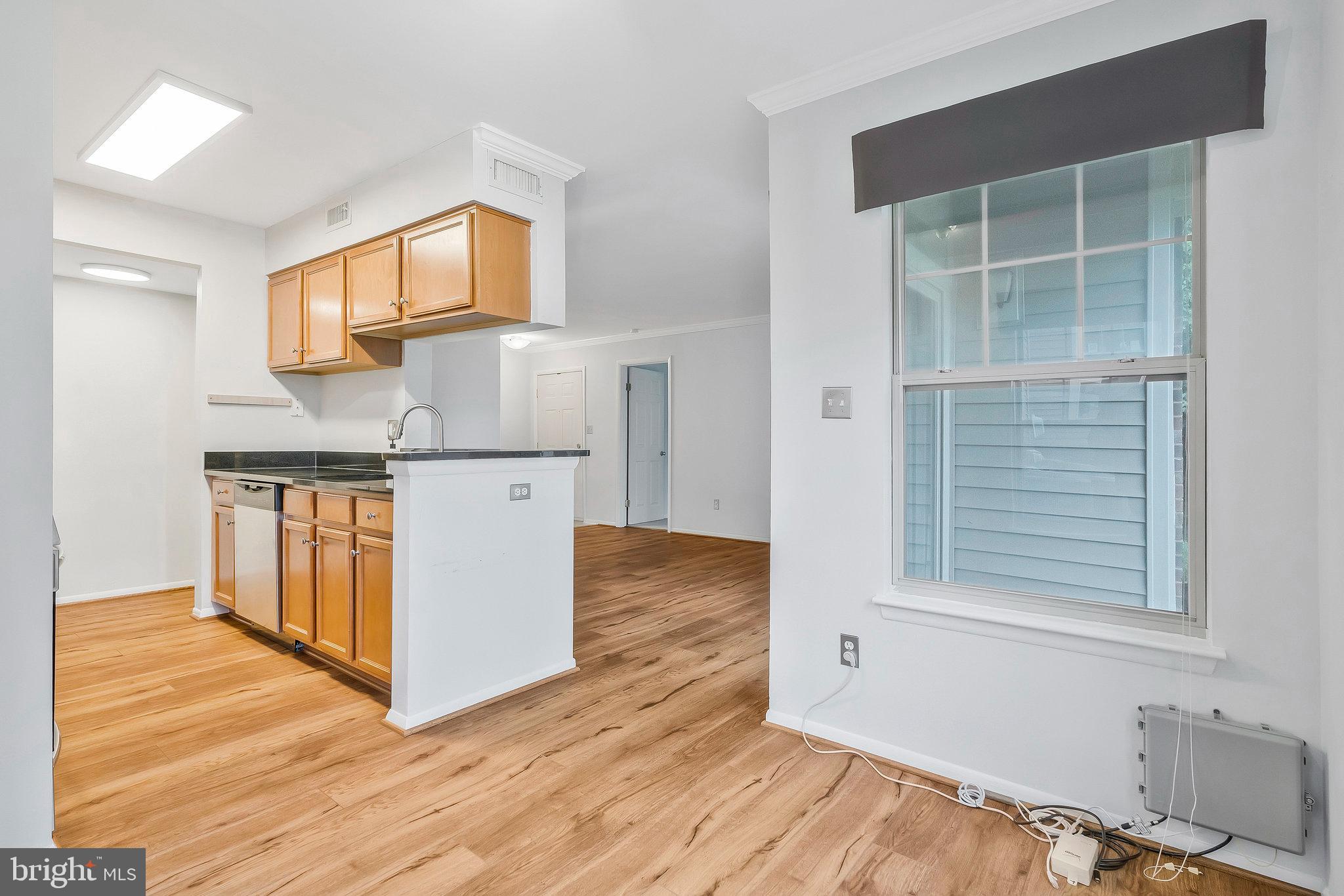 1701 Ascot Way, Unit 1701A Reston, VA 20190 - Photo 14 of 32 a view of kitchen with wooden floor and electronic appliances