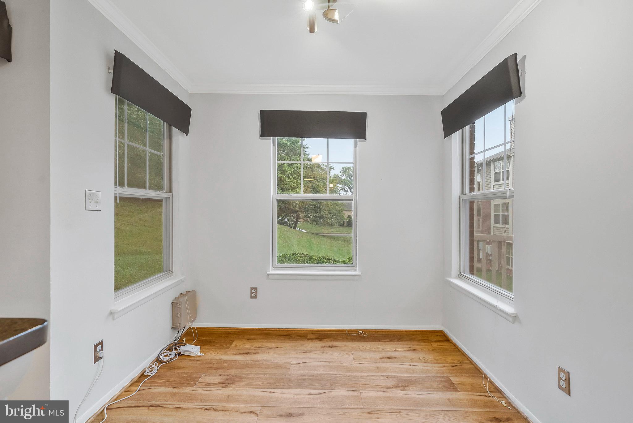 1701 Ascot Way, Unit 1701A Reston, VA 20190 - Photo 19 of 32 a view of an empty room with window