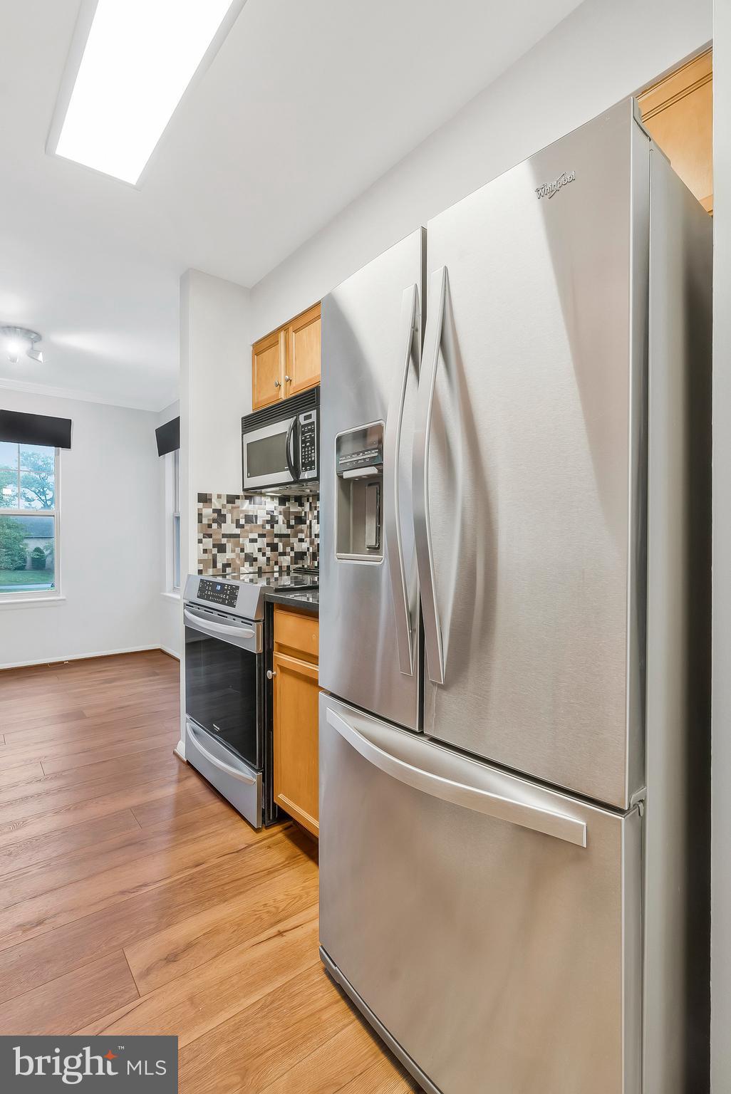 1701 Ascot Way, Unit 1701A Reston, VA 20190 - Photo 21 of 32 a kitchen with stainless steel appliances a refrigerator and a stove top oven
