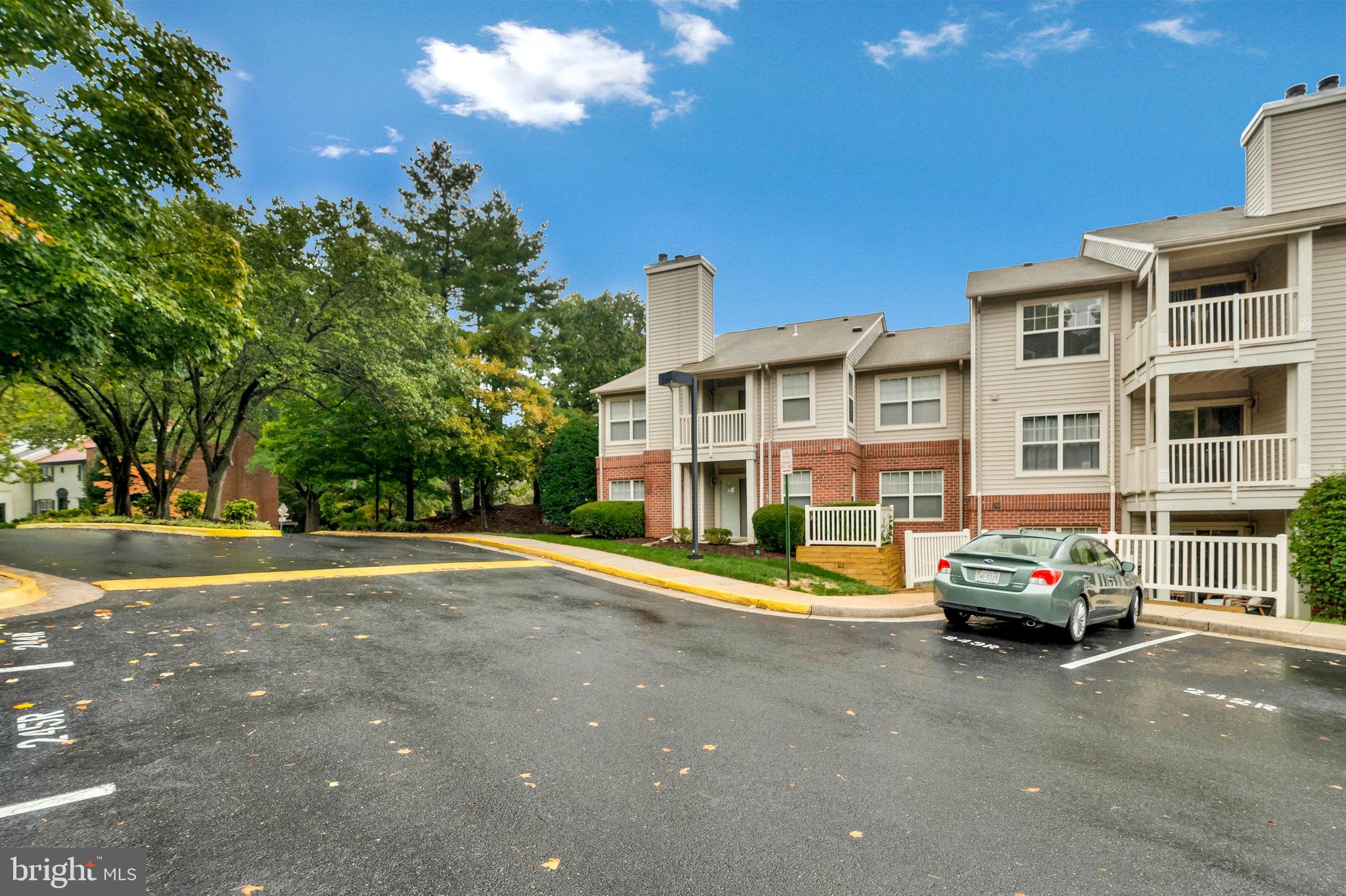1701 Ascot Way, Unit 1701A Reston, VA 20190 - Photo 31 of 32 a front view of a building with cars parked