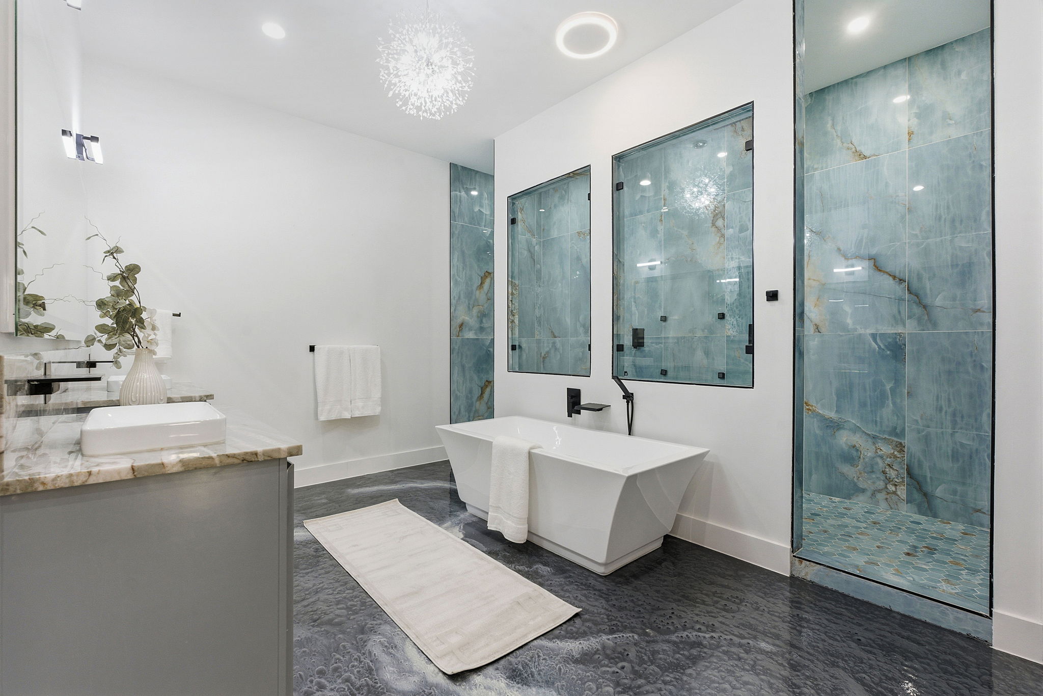 15400 Watumba Road Austin, TX 78734 - Photo 19 of 39 a spacious bathroom with a double vanity sink mirror and shower