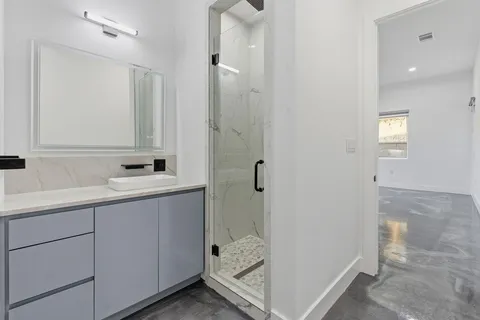 a bathroom with a sink and mirror