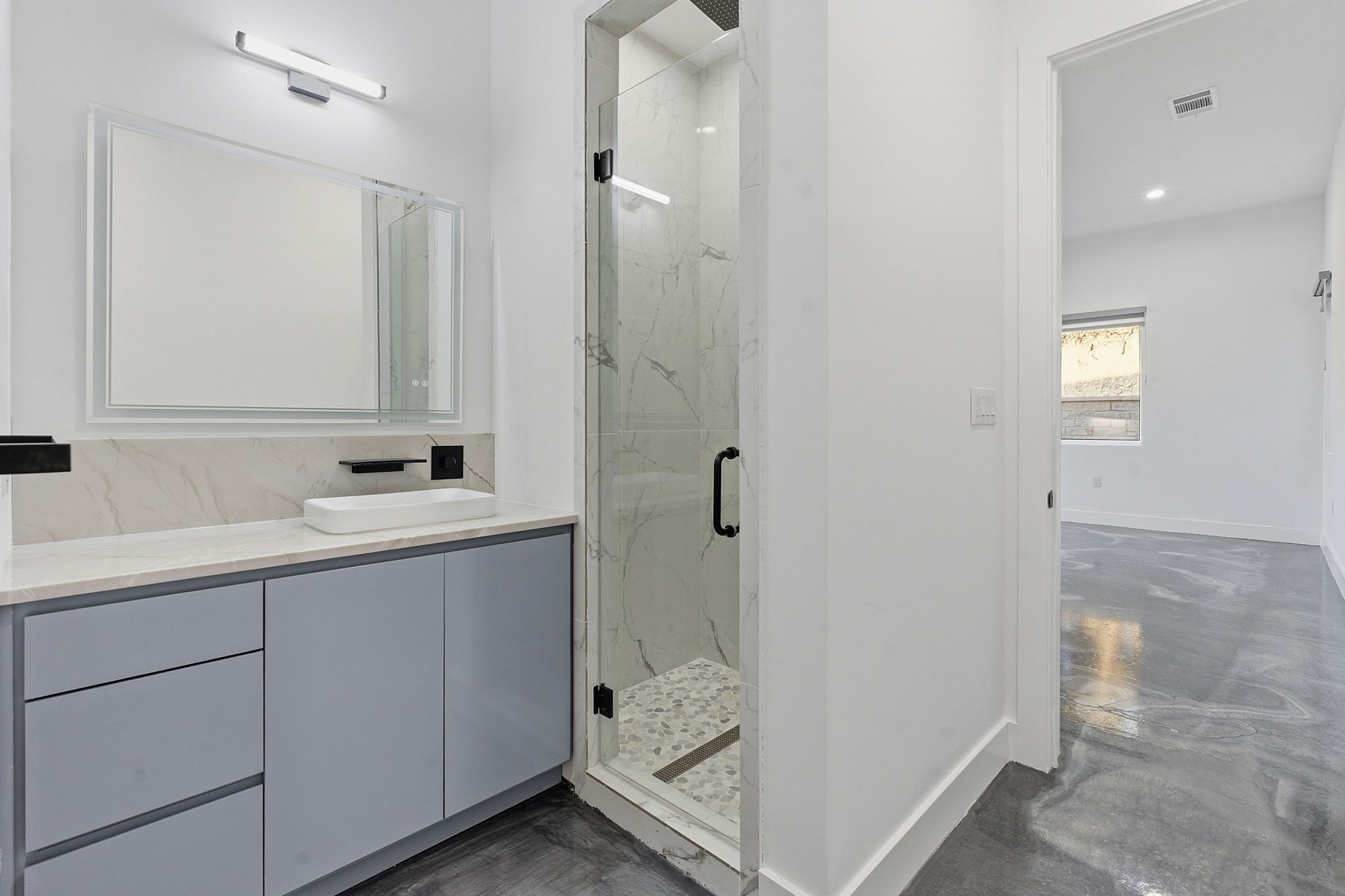 15400 Watumba Road Austin, TX 78734 - Photo 30 of 39 a bathroom with a sink and mirror
