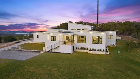 a view of a patio with a table and chairs