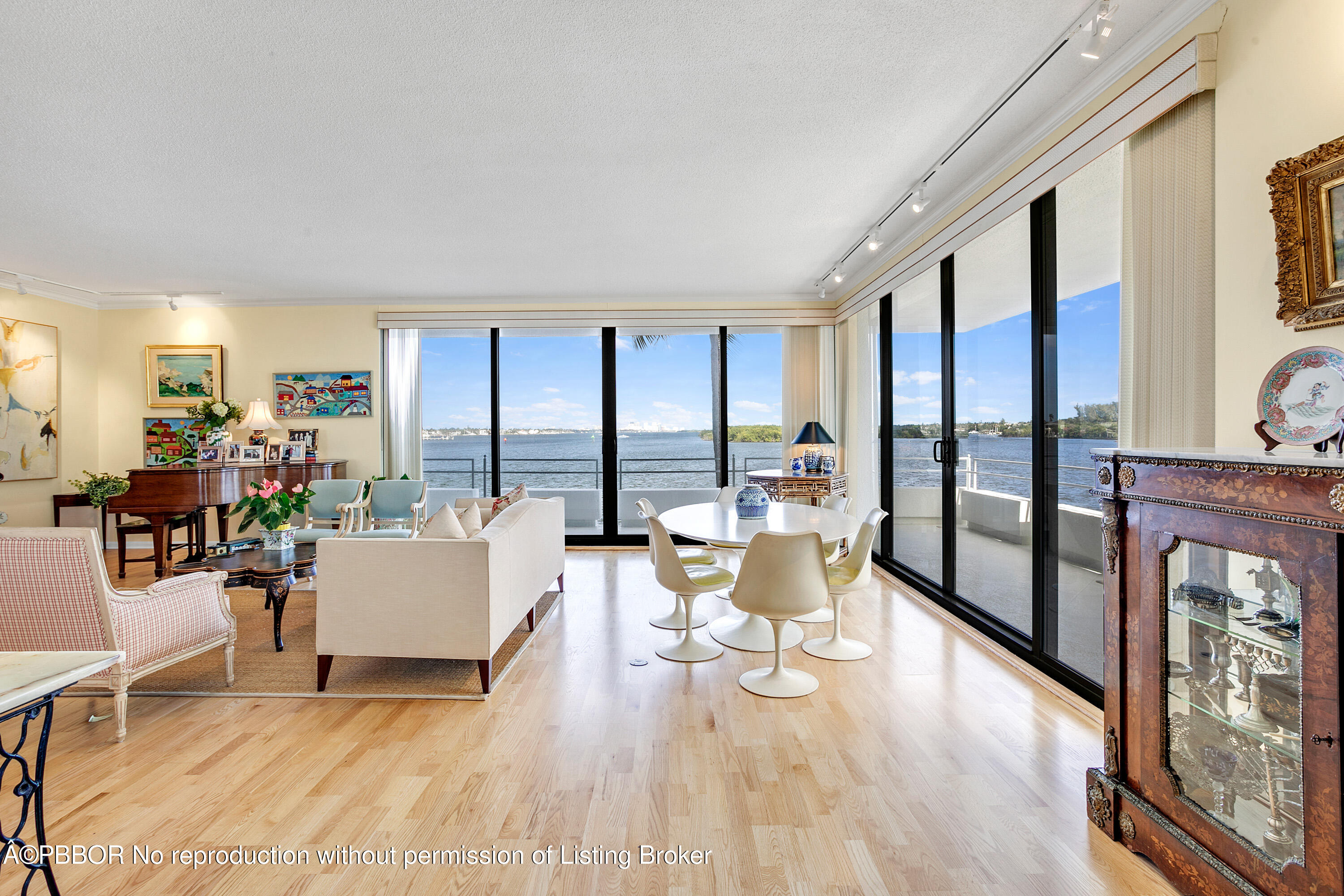 a living room with furniture and large windows