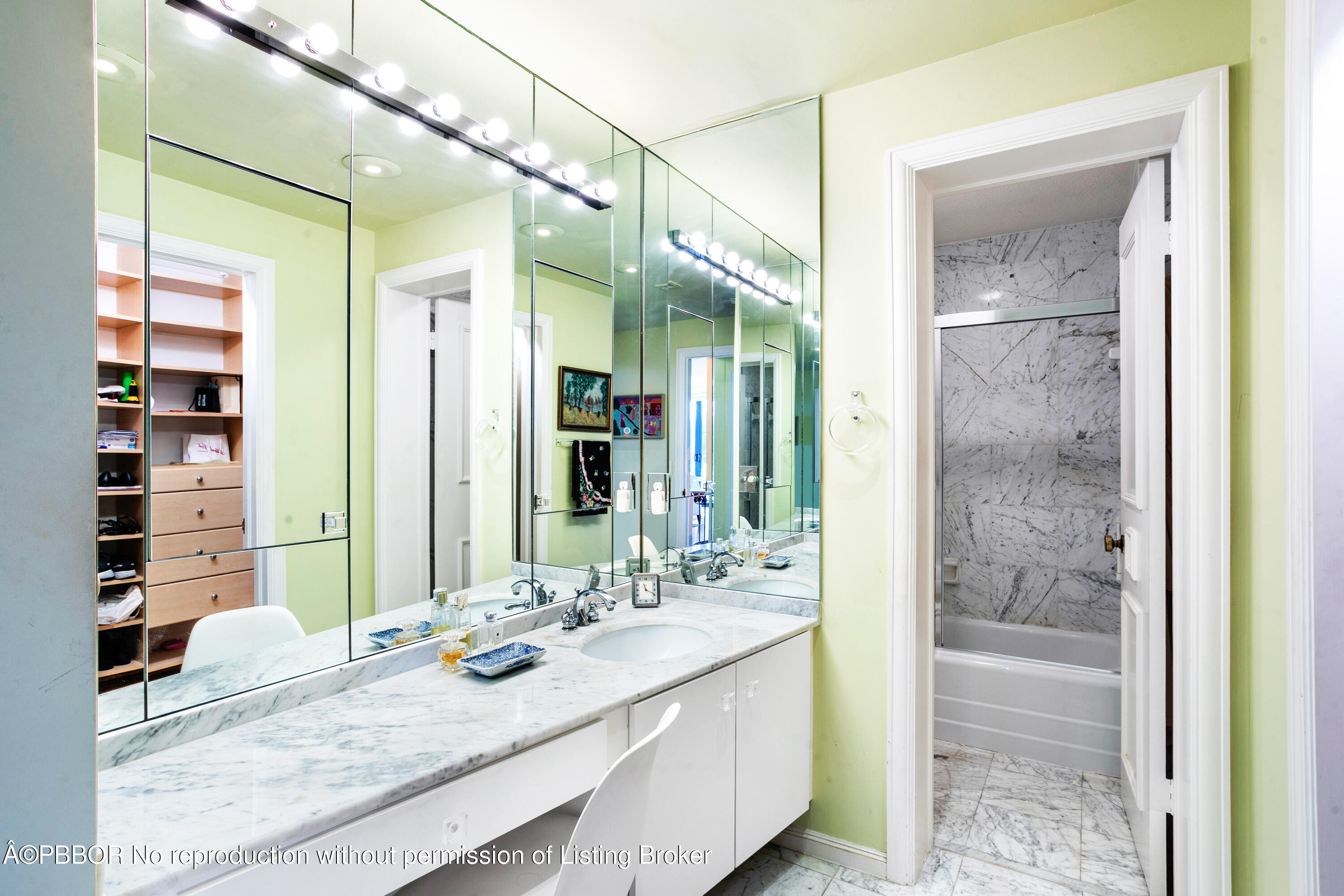 2150 Ibis Isle Road, Unit 7 Palm Beach, FL 33480 - Photo 14 of 49 a bathroom with a granite countertop sink a large mirror and a shower