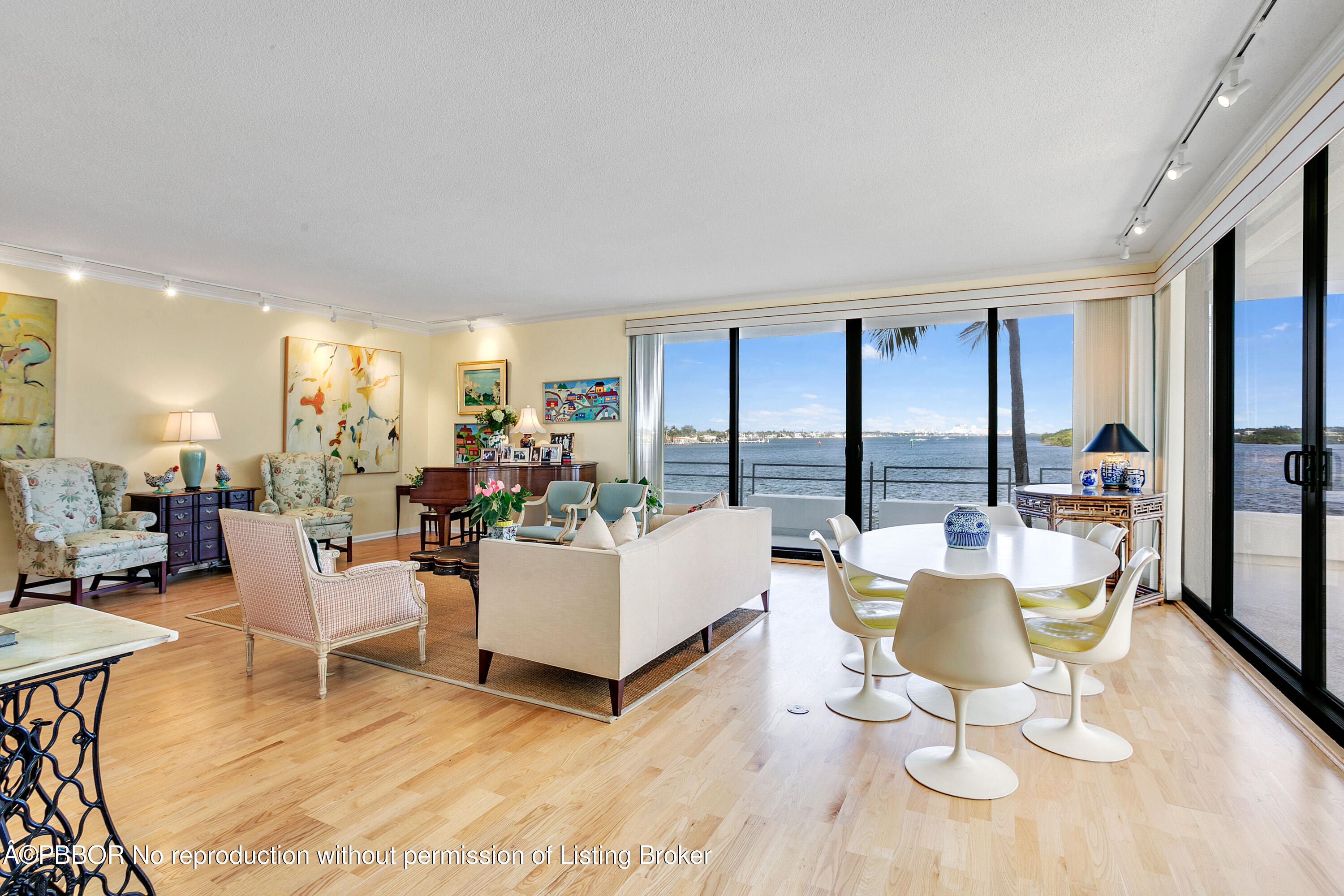2150 Ibis Isle Road, Unit 7 Palm Beach, FL 33480 - Photo 19 of 49 a living room with furniture a wooden floor and a large window