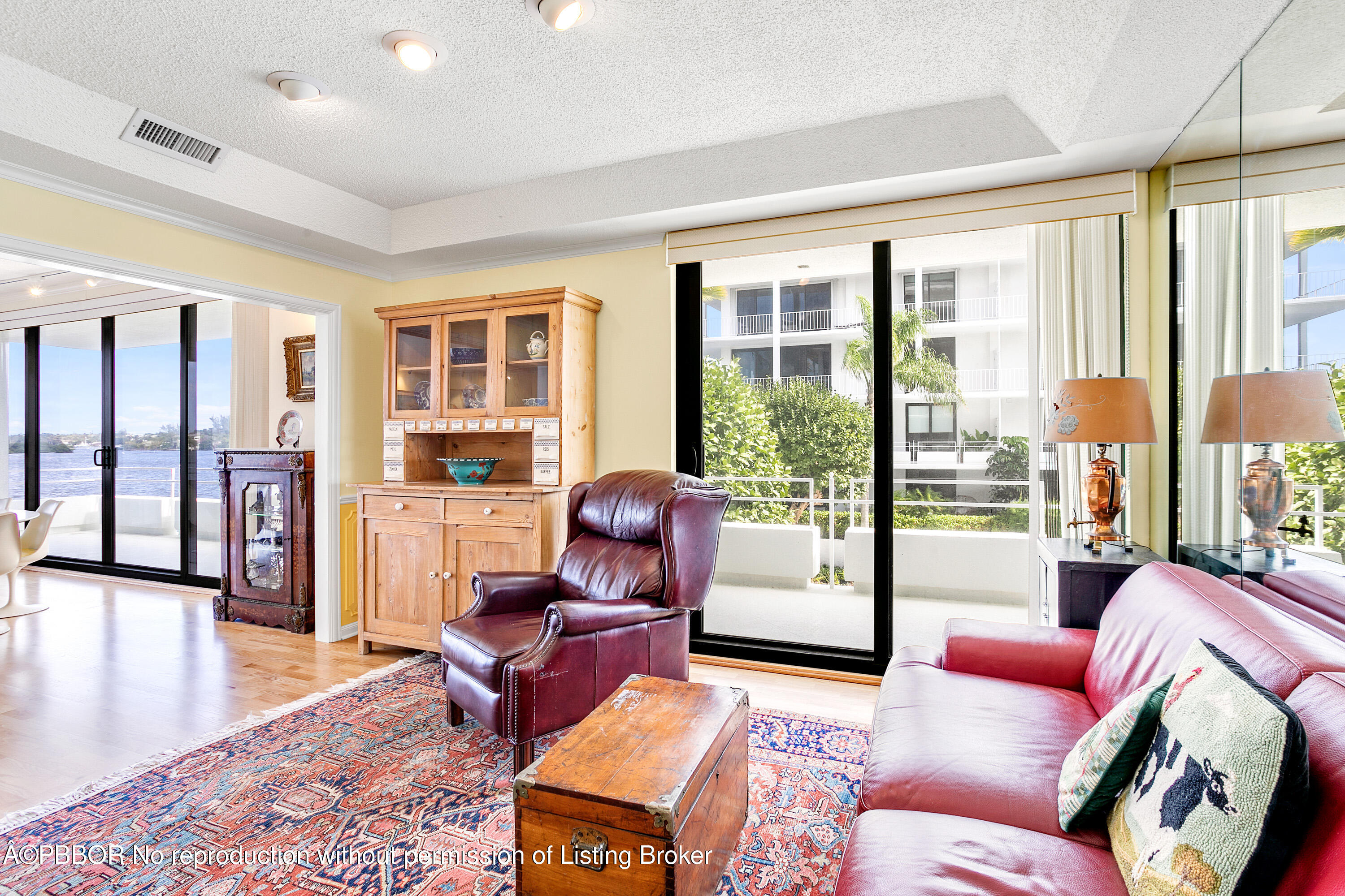 2150 Ibis Isle Road, Unit 7 Palm Beach, FL 33480 - Photo 23 of 49 a living room with furniture and floor to ceiling windows