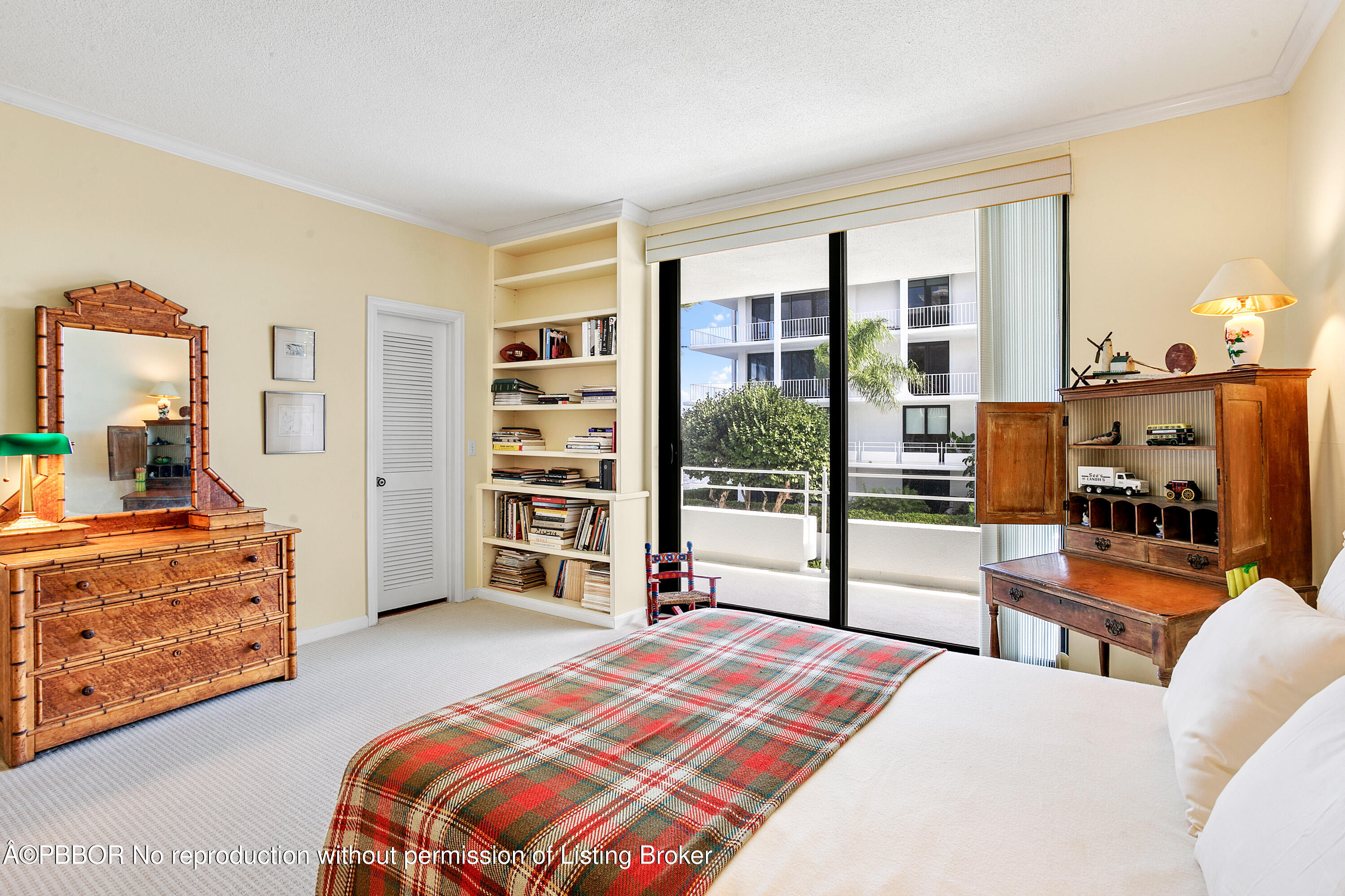 2150 Ibis Isle Road, Unit 7 Palm Beach, FL 33480 - Photo 29 of 49 a bedroom with a bed and a dresser next to a window