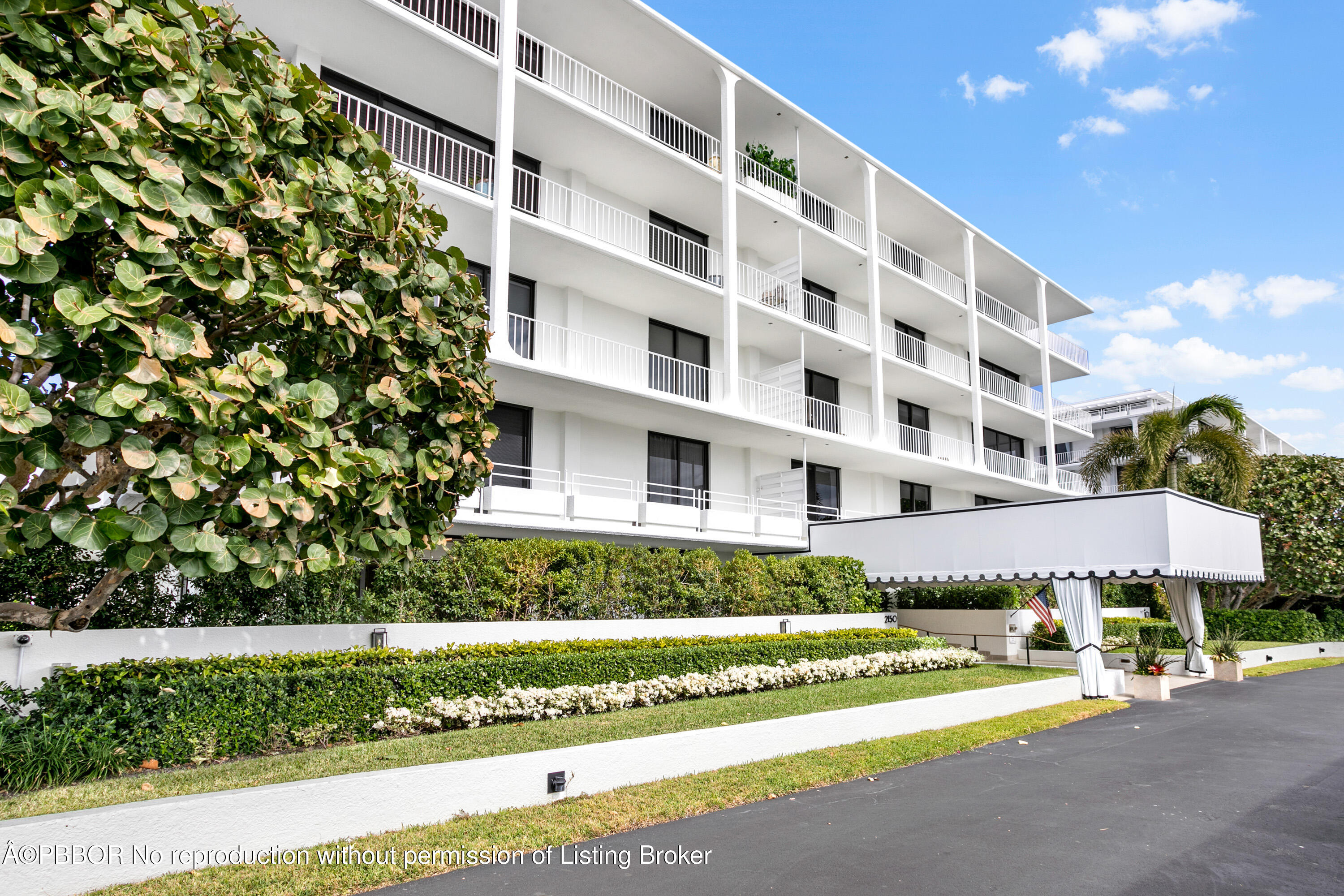 2150 Ibis Isle Road, Unit 7 Palm Beach, FL 33480 - Photo 35 of 49 a view of a tall building next to a yard