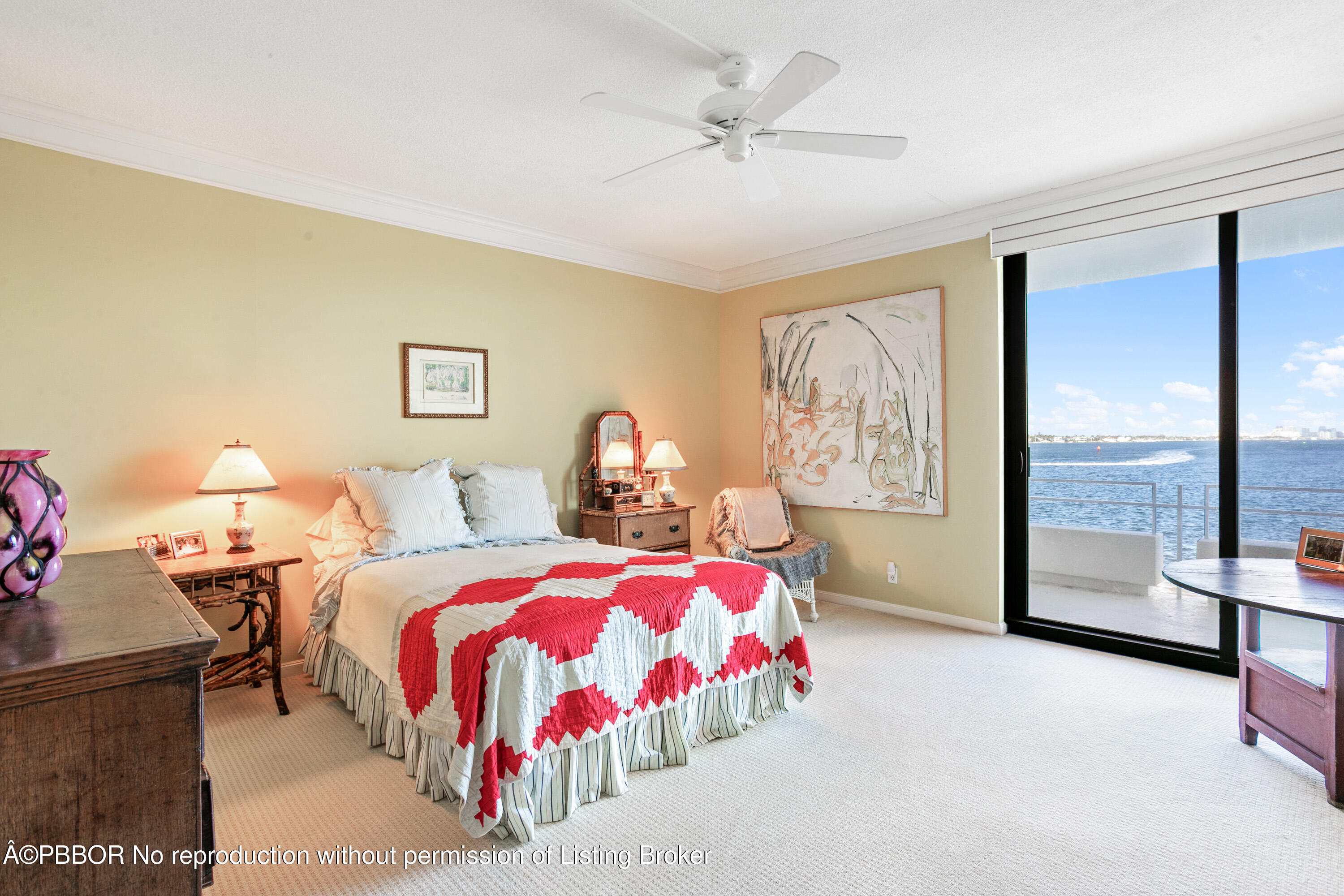 2150 Ibis Isle Road, Unit 7 Palm Beach, FL 33480 - Photo 10 of 49 a bedroom with a bed lamps and window