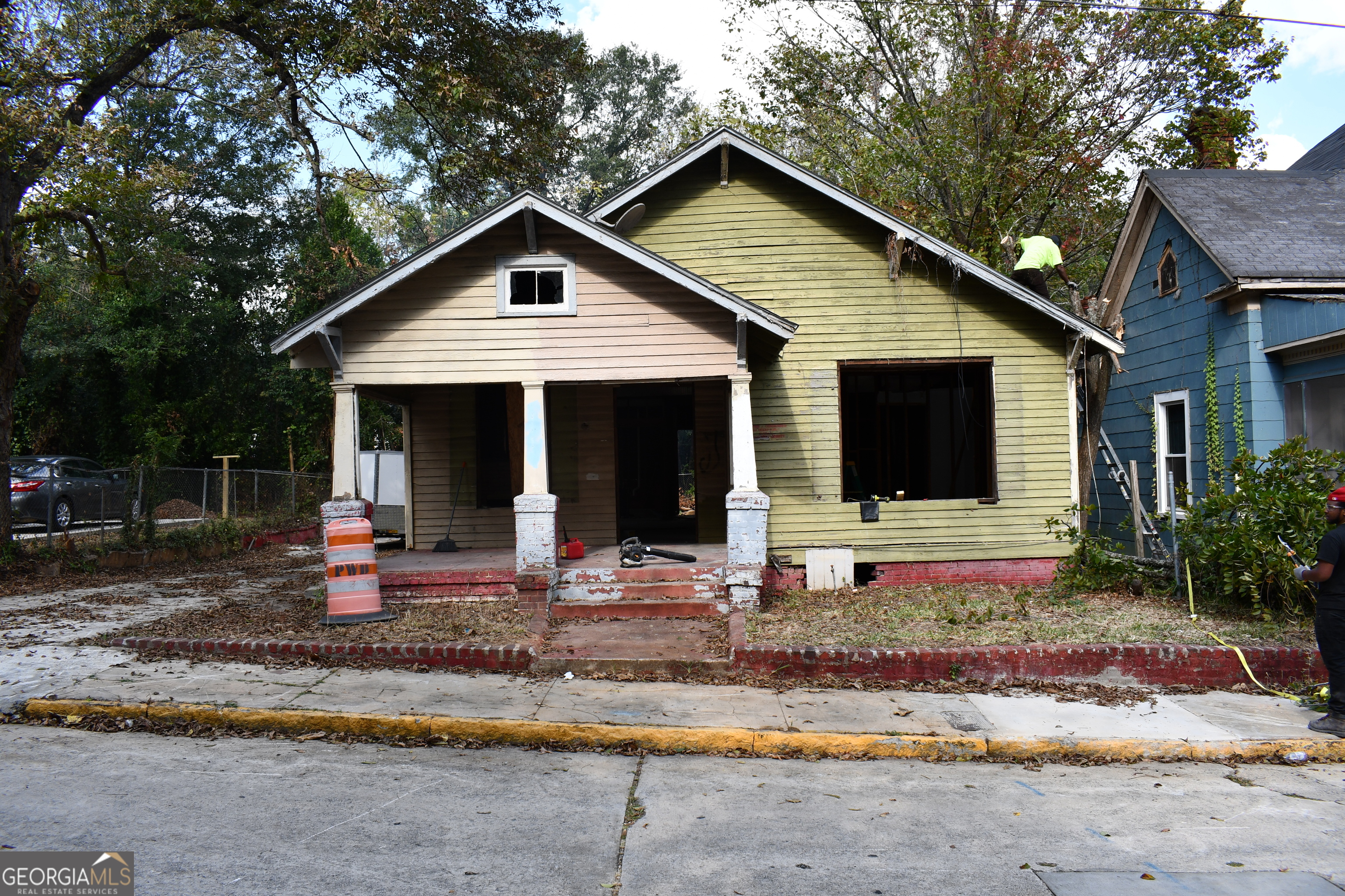 a front view of a house with sitting area