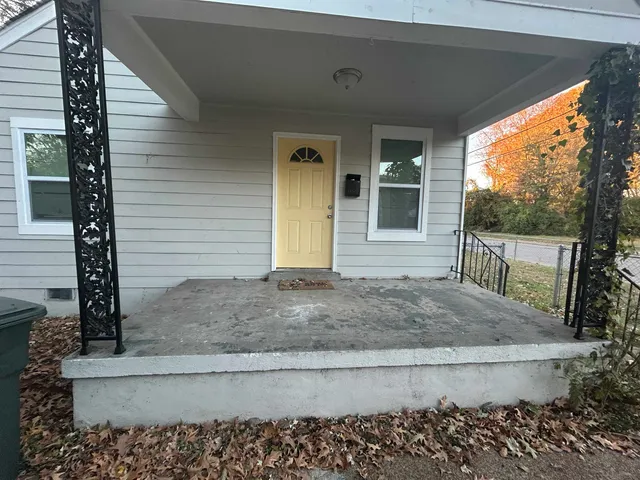 a view of front door and potted plants