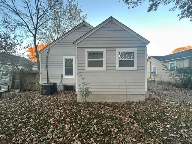 a house with a white fence