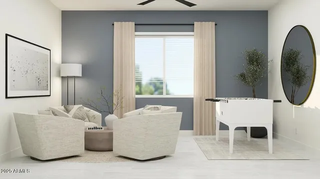 a living room with a couch and a potted plant